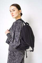 Pleats Please Issey Miyake Pleated Backpack in Black Vancouver. Shop Online or in Store. 
