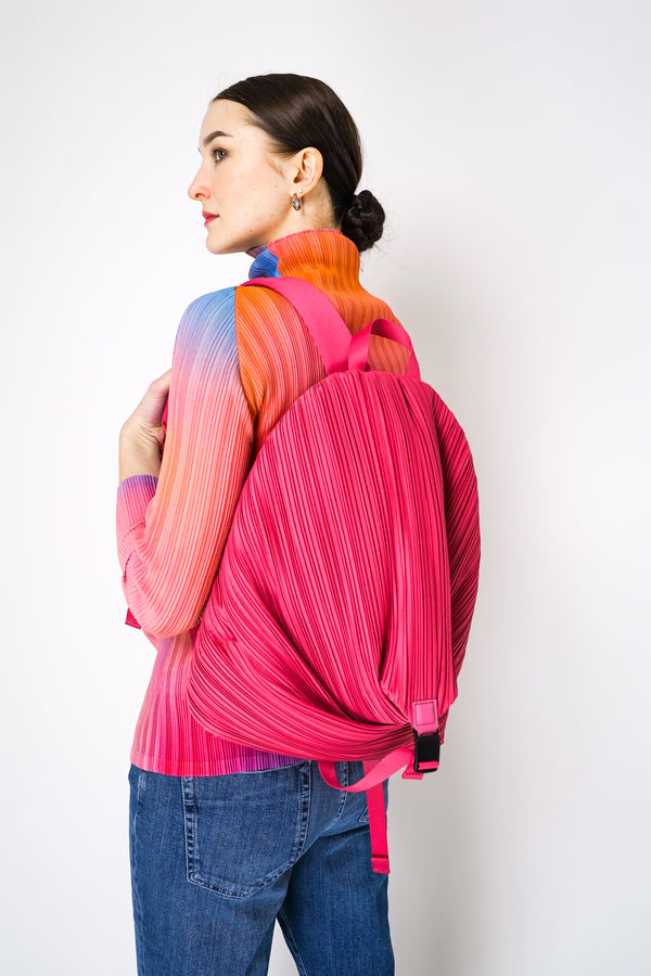 Pleats Please Issey Miyake Pleated Backpack in Pink Vancouver. Shop Online or in Store. 
