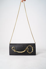 Alexis Bittar Twisted Gold Side Handle Clutch Purse in Black Vancouver. Shop Online or in Store.