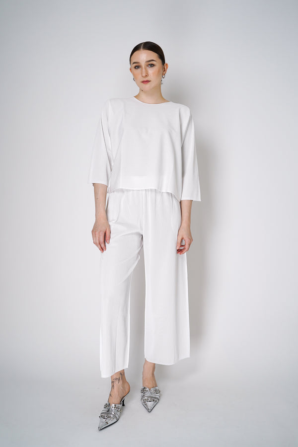 Pleats Please Issey Miyake A-Poc Form Long Sleeve Top in White Vancouver. Shop Online or in Store. 