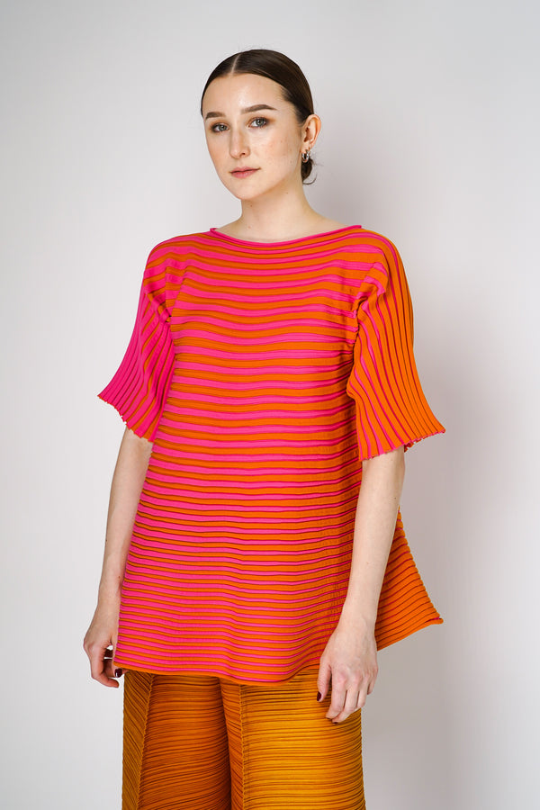 Pleats Please Issey Miyake Bounce Knit Short Sleeve Flared Top in Orange and Pink Vancouver. Shop Online or in Store. 