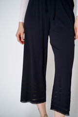 Pleats Please Issey Miyake A-Poc Basics Straight Leg Pants in Black Vancouver. Shop Online or in Store. 