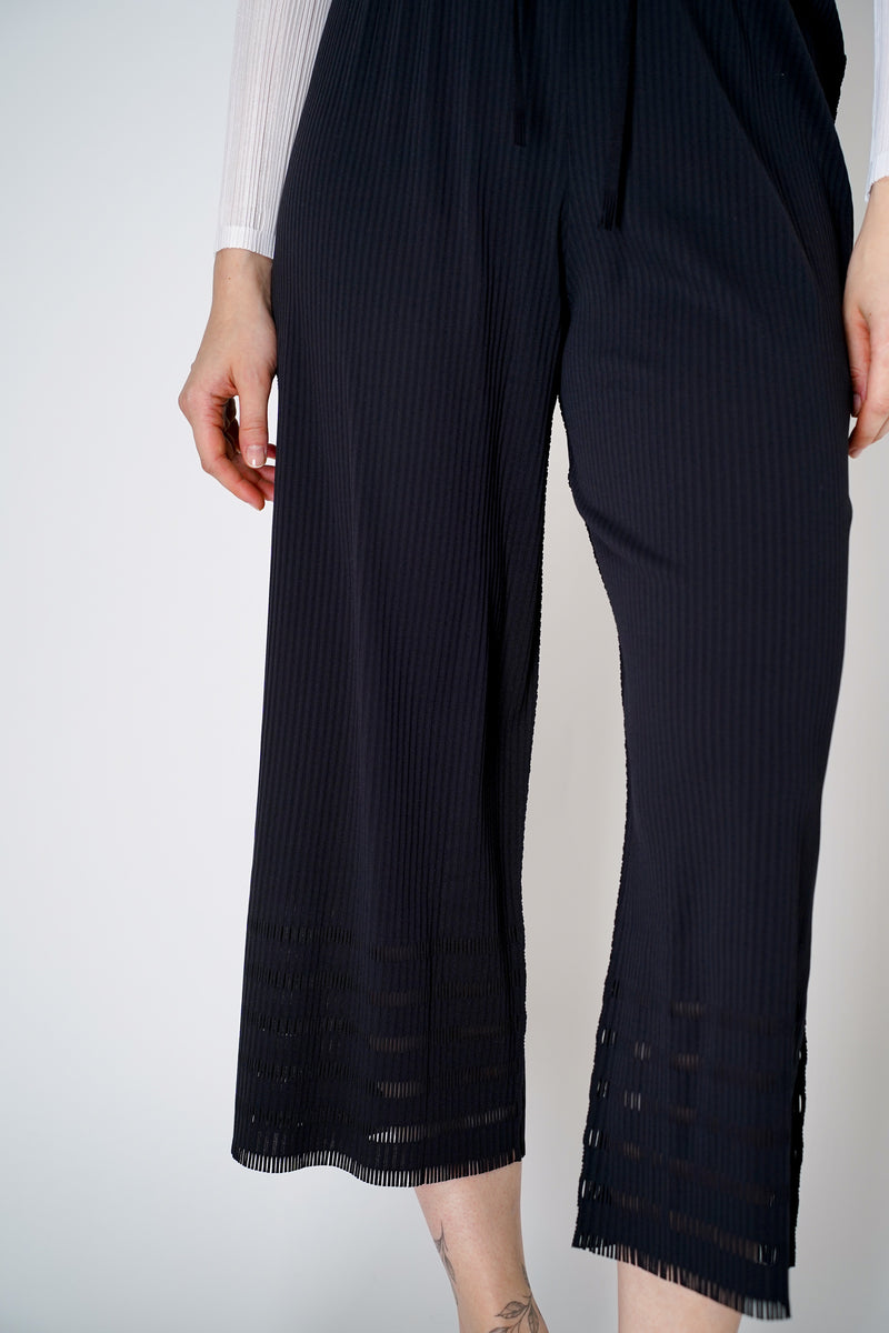 Pleats Please Issey Miyake A-Poc Basics Straight Leg Pants in Black Vancouver. Shop Online or in Store. 