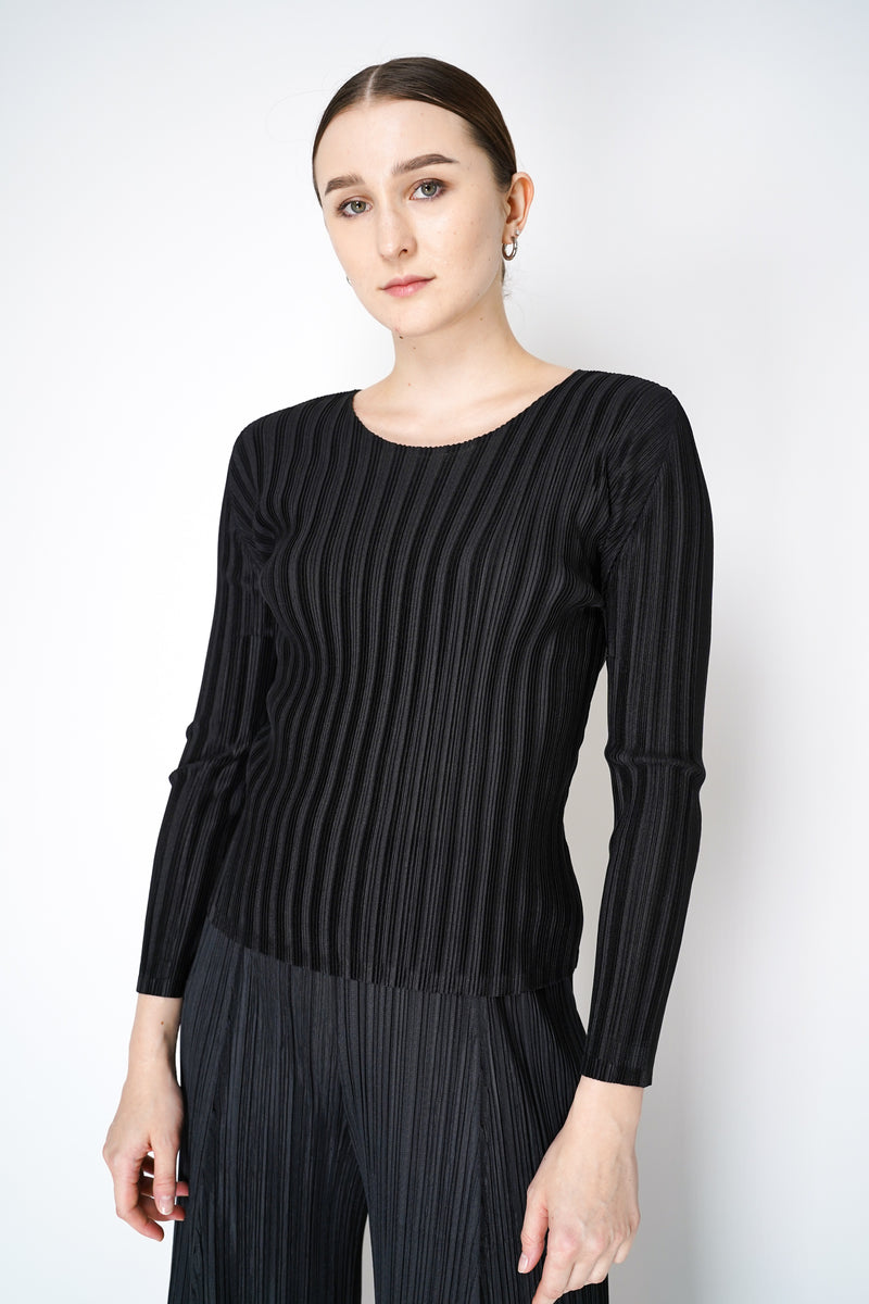 Pleats Please Issey Miyake Rib Pleats Basics Long Sleeve Top in Black Vancouver. Shop Online or in Store. 