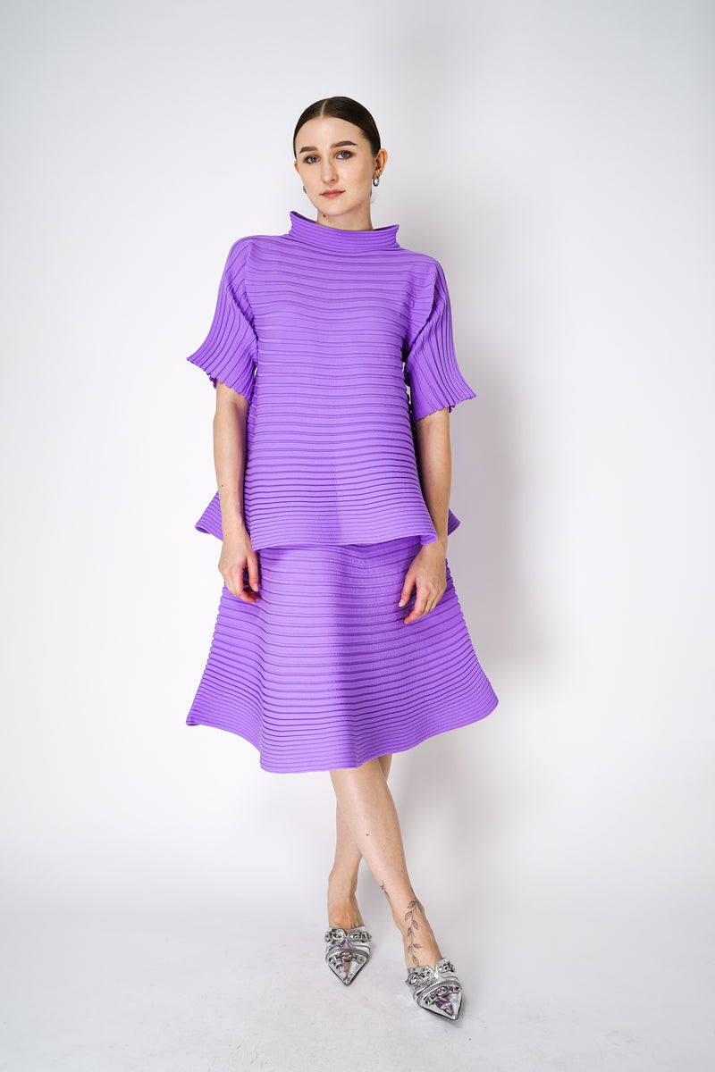 Pleats Please Issey Miyake Bounce Knit High Neck Flared Top in Lilac Vancouver. Shop Online or in Store. 