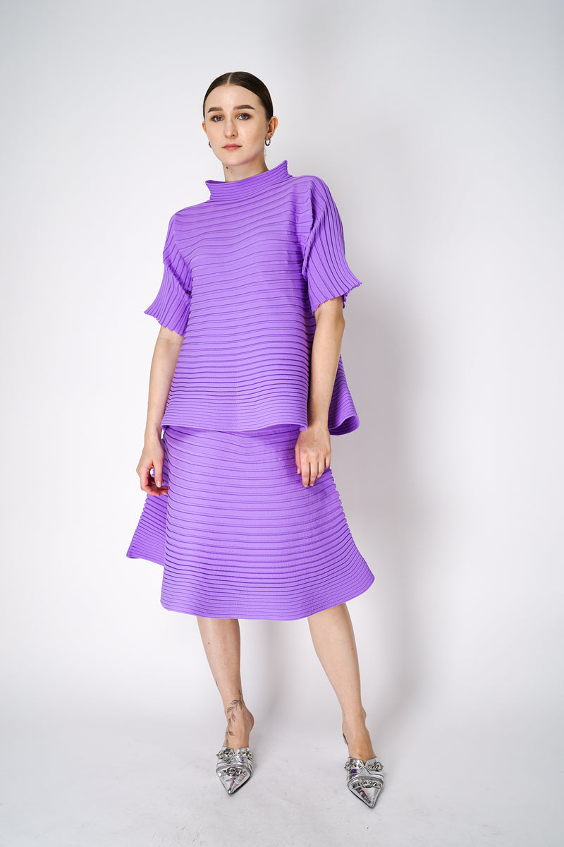 Pleats Please Issey Miyake Bounce Knit High Neck Flared Top in Lilac Vancouver. Shop Online or in Store. 