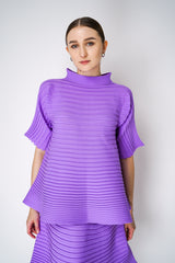 Pleats Please Issey Miyake Bounce Knit High Neck Flared Top in Lilac Vancouver. Shop Online or in Store. 